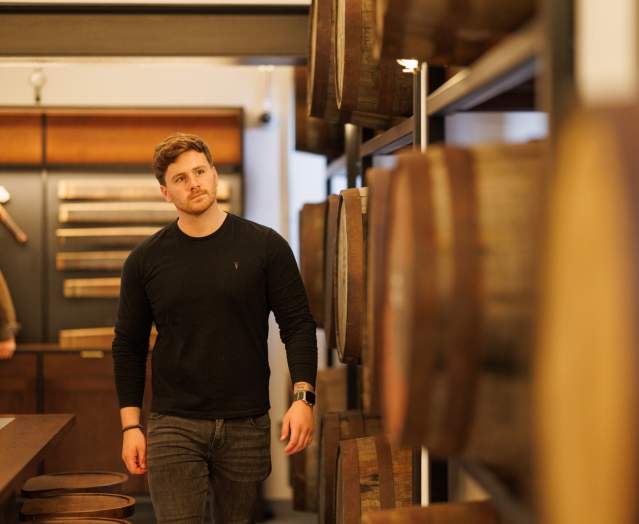 man at a distillery