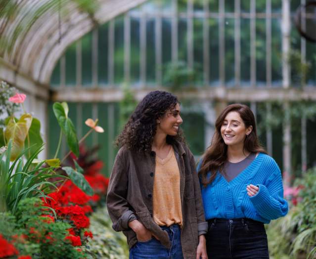 2 girls walking through the Tropical Ravine at Botanic Gardens.