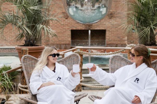 Two girls enjoying cocktails outdoors at The Rabbit spa