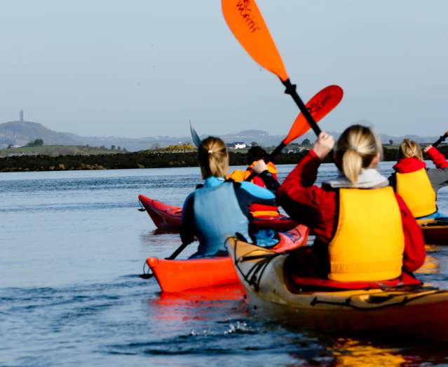 A group kayaking on Strangford Lough.