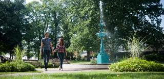 couple walking in Lisburn-Castle-Gardens