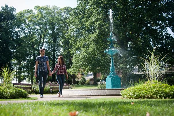 couple walking in Lisburn-Castle-Gardens