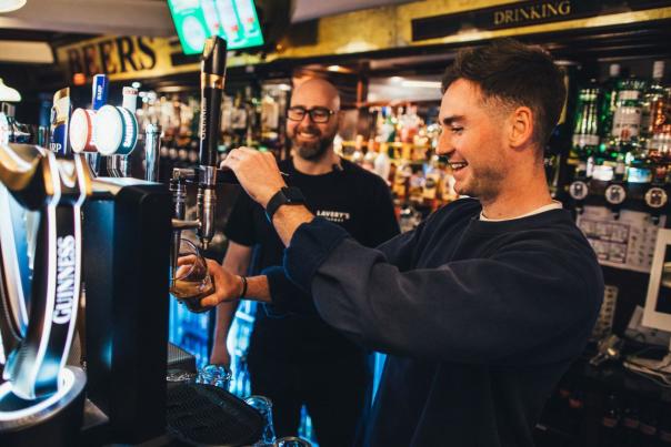 Man pouring his own pint of Guinness