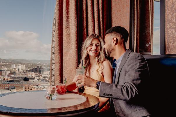A couple enjoying cocktails in the Observatory bar in the Grand Central Hotel.