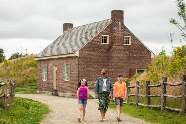 Family walking through the Ulster American Folk Park