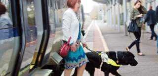 Women-with-Guide-Dog-using-Translink-Train