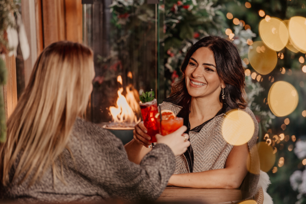 Two girls enjoying a cocktail in Belfast.