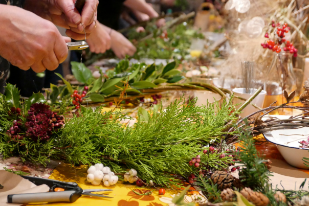A woman making a Christmas wreath